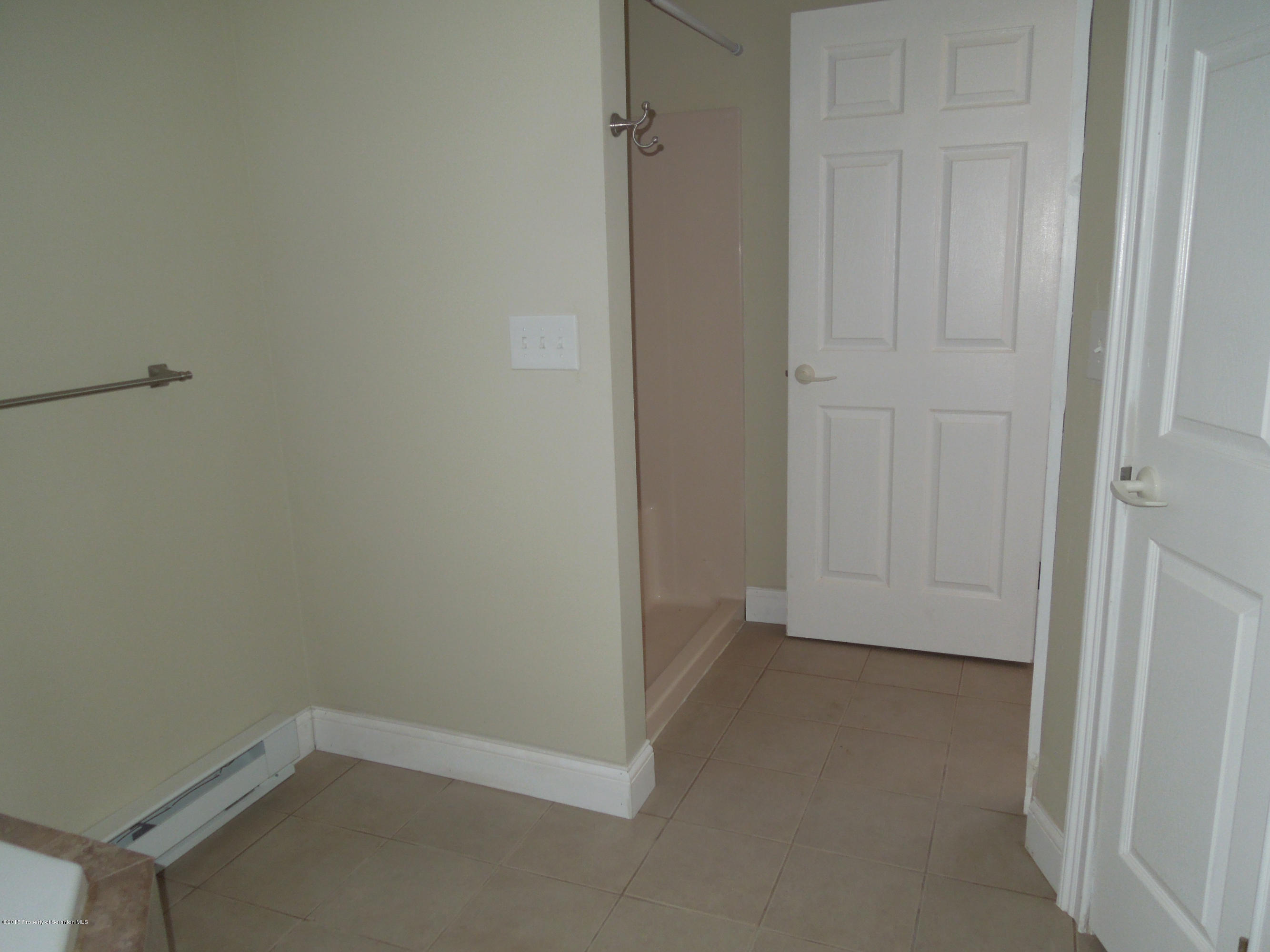 474 Fairview Road Dalton, PA 18414 - Photo 12 of 21 an empty room with a workbench