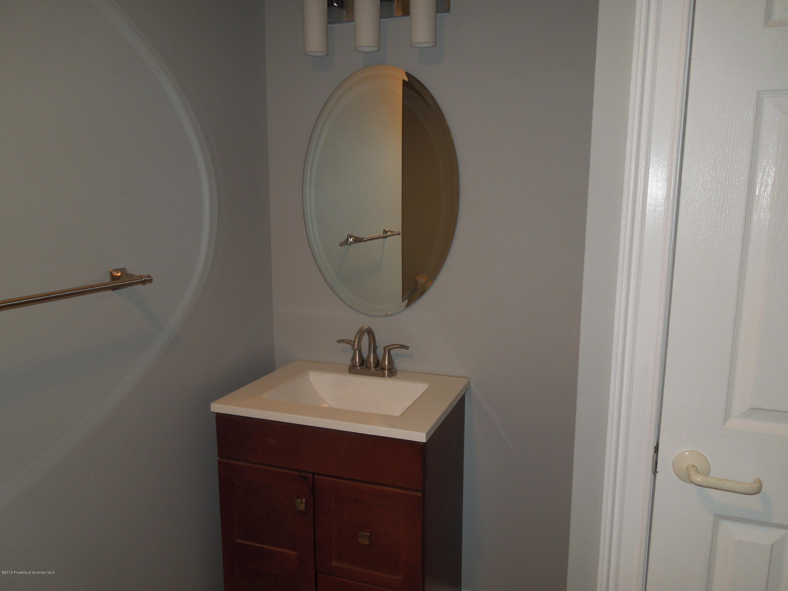 474 Fairview Road Dalton, PA 18414 - Photo 14 of 21 a bathroom with a sink and a mirror