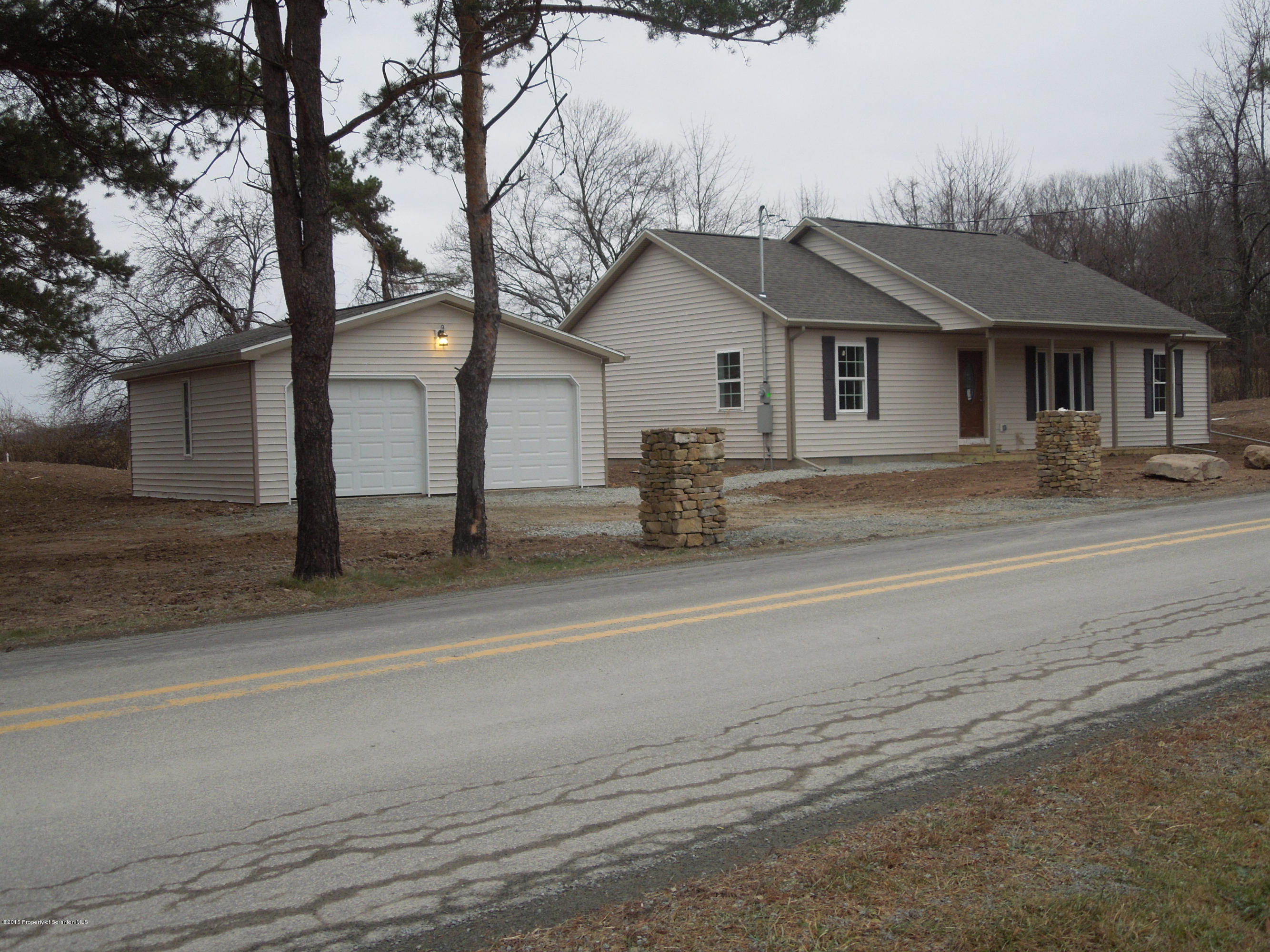 474 Fairview Road Dalton, PA 18414 - Photo 3 of 21 a front view of a house with a yard