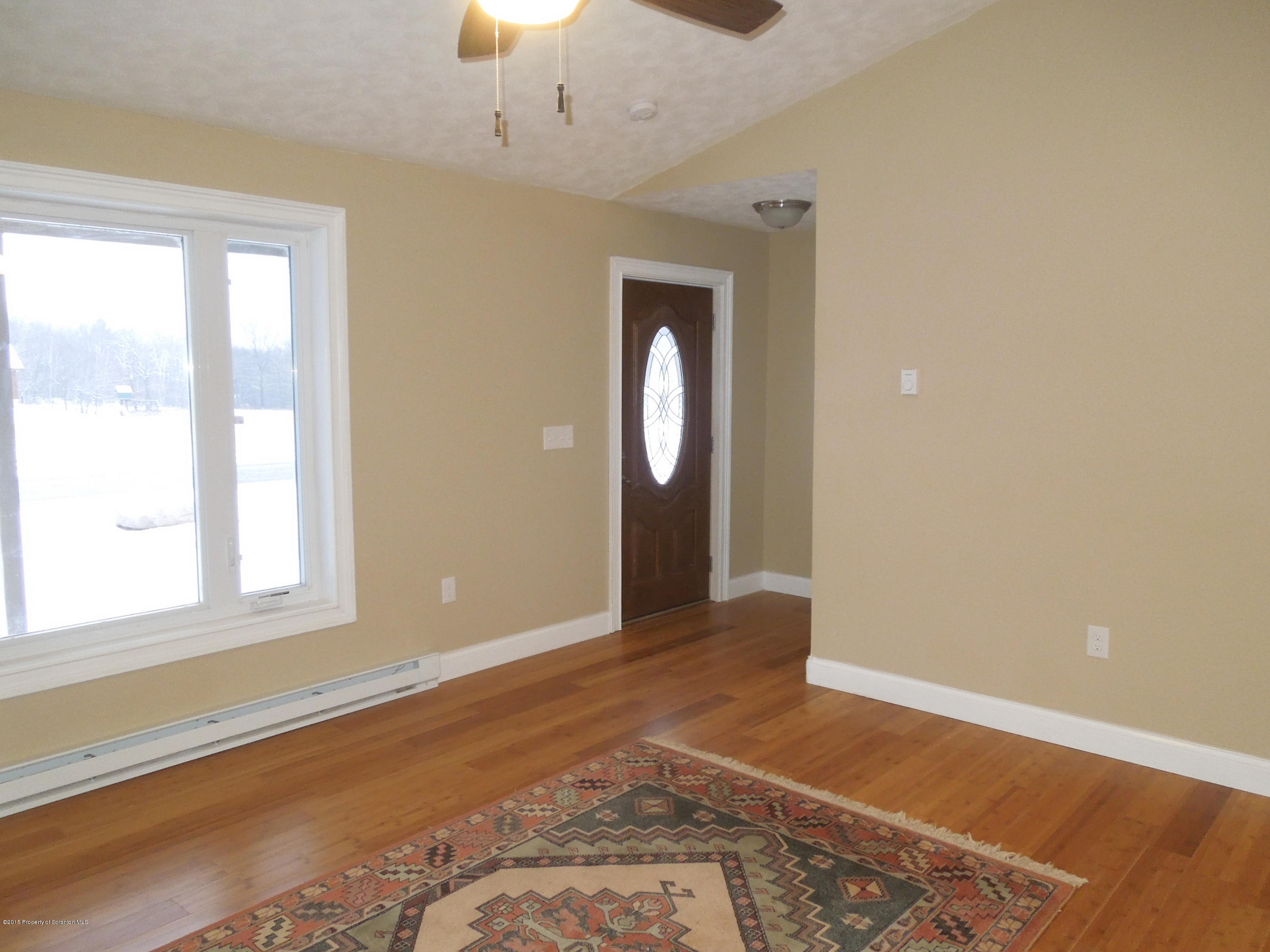 474 Fairview Road Dalton, PA 18414 - Photo 7 of 21 wooden floor in an empty room with a window