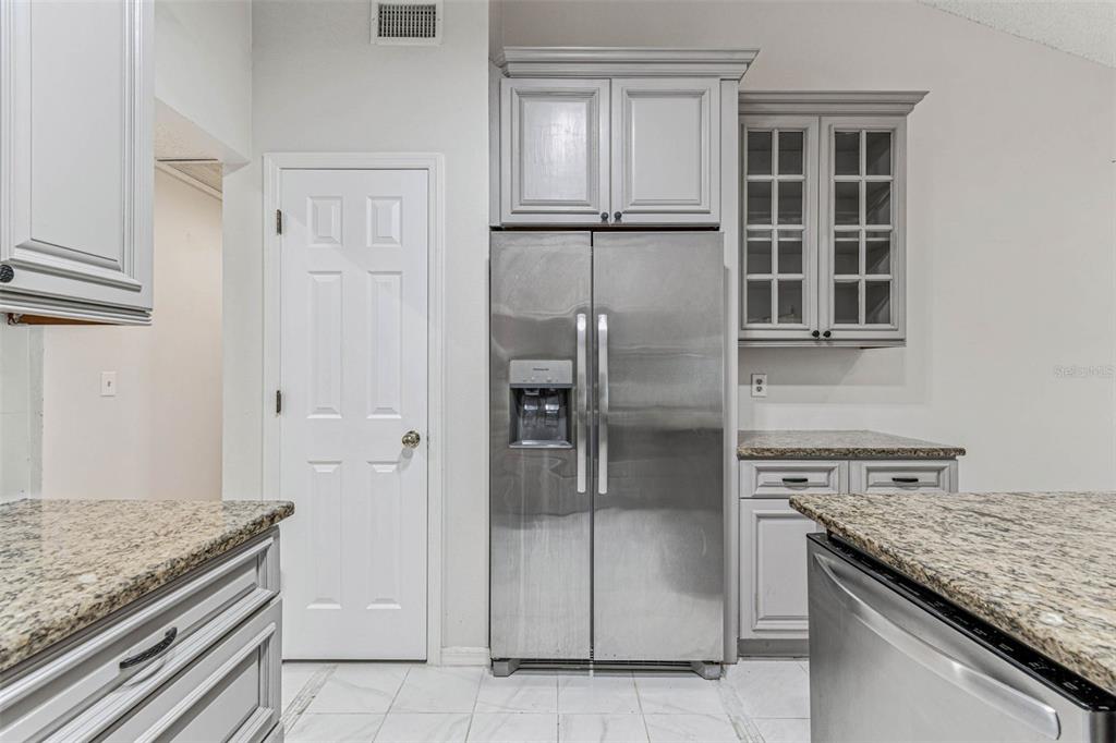7206 Ridgeport Drive Tampa, FL 33647 - Photo 13 of 78 a kitchen with granite countertop a refrigerator and a stove