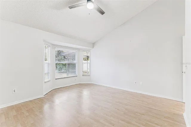 an empty room with windows and entrance