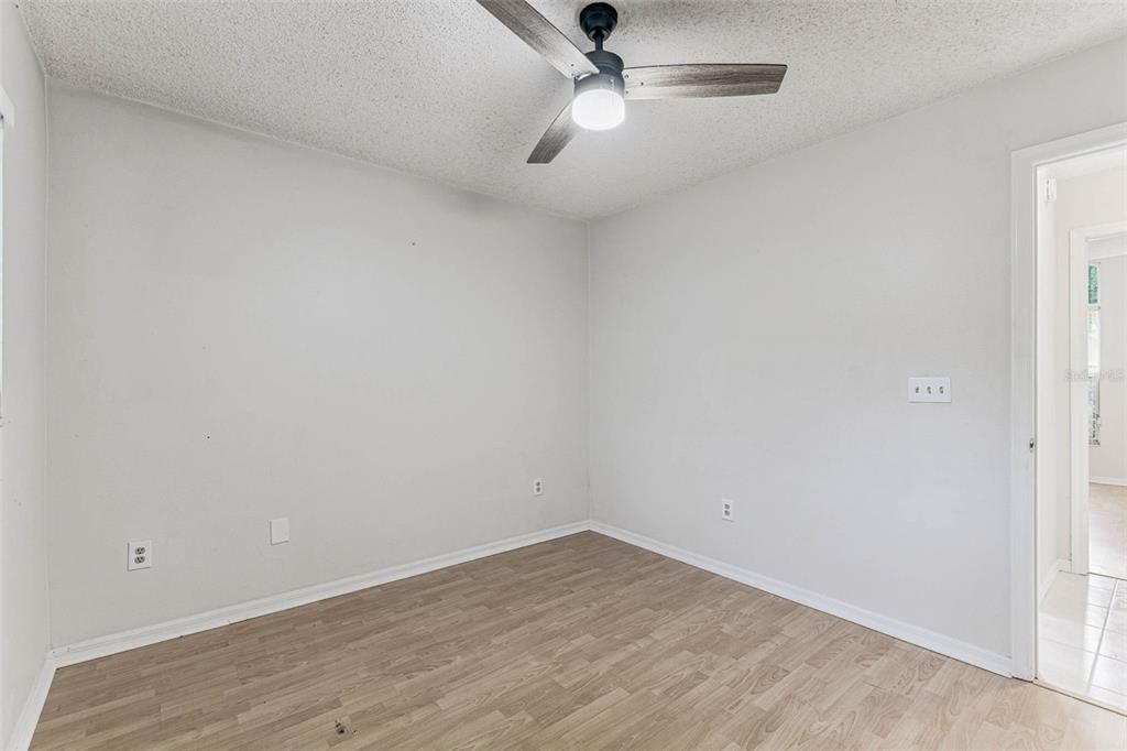 7206 Ridgeport Drive Tampa, FL 33647 - Photo 38 of 78 an empty room with a window and ceiling fan