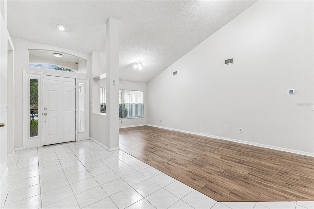 7206 Ridgeport Drive Tampa, FL 33647 - Photo 41 of 78 a view of a hallway with wooden floor and a bathroom