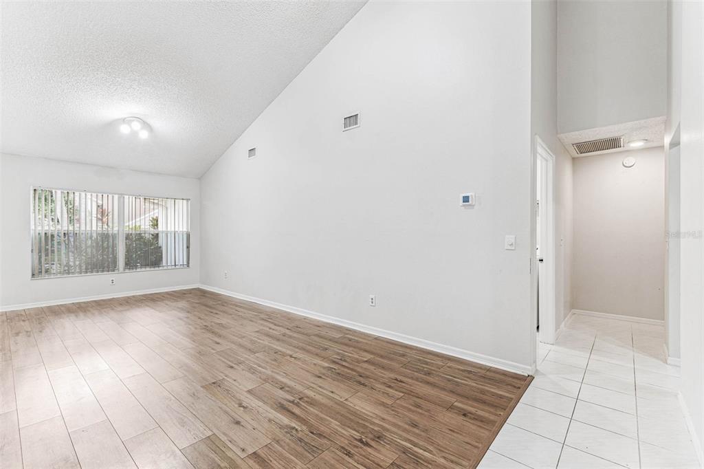 7206 Ridgeport Drive Tampa, FL 33647 - Photo 42 of 78 wooden floor in an empty room with a window