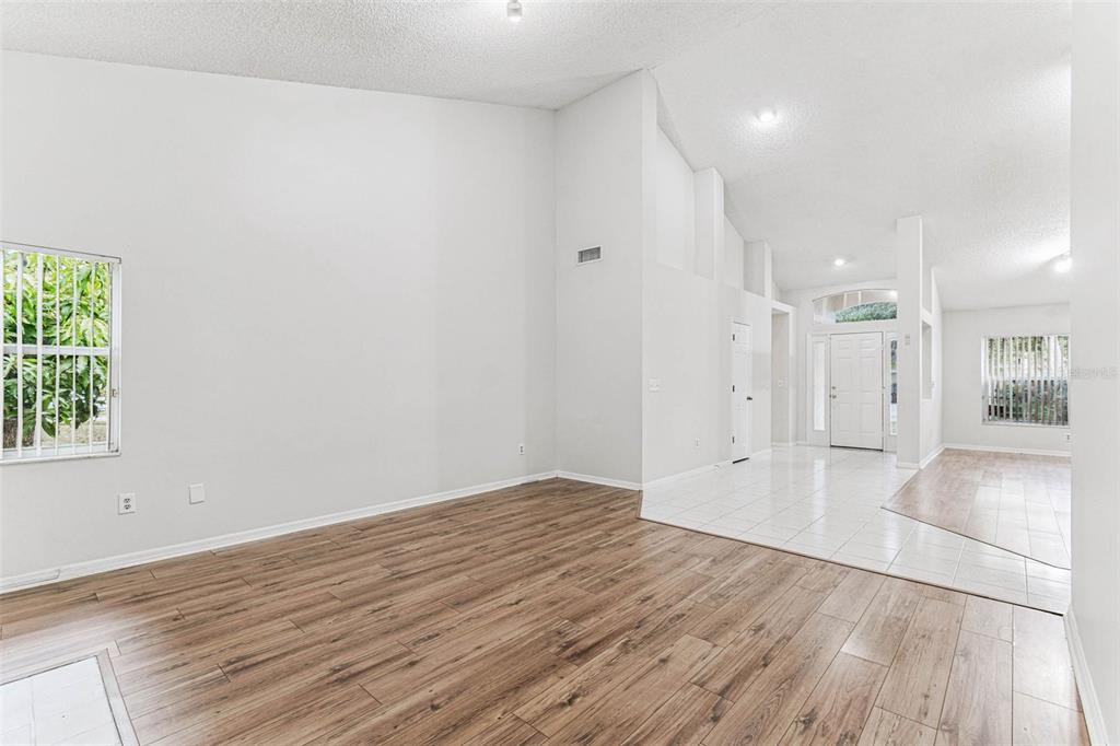 7206 Ridgeport Drive Tampa, FL 33647 - Photo 50 of 78 wooden floor in an empty room with a window