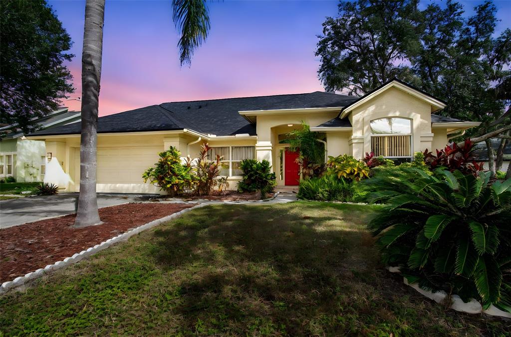 7206 Ridgeport Drive Tampa, FL 33647 - Photo 5 of 78 a front view of a house with garden
