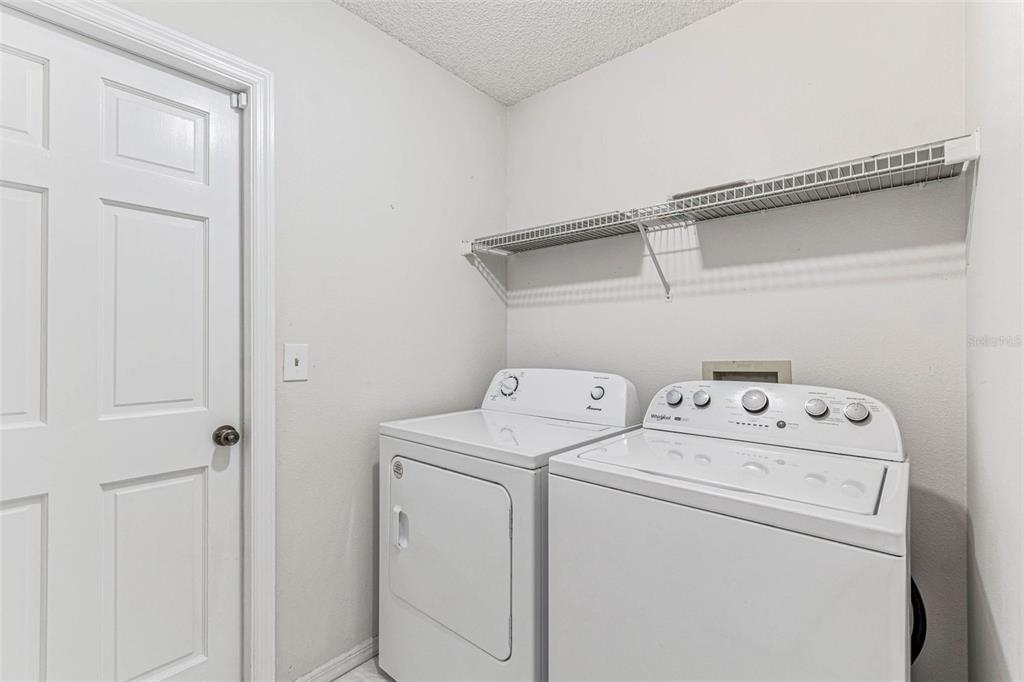 7206 Ridgeport Drive Tampa, FL 33647 - Photo 56 of 78 a view of storage and utility room with washer and dryer