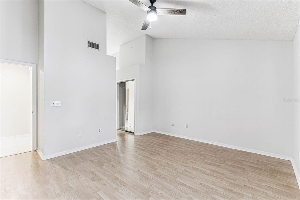 7206 Ridgeport Drive Tampa, FL 33647 - Photo 59 of 78 an empty room with a ceiling fan and carpet