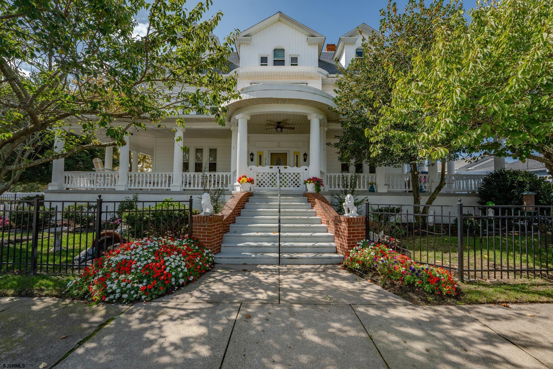 216 East Fern Road Wildwood Crest, NJ 08260 - Photo 1 of 93 front view of a house with a garden