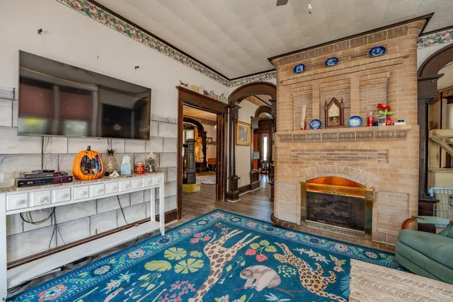 a bedroom with a bed and a flat tv screen on the dresser