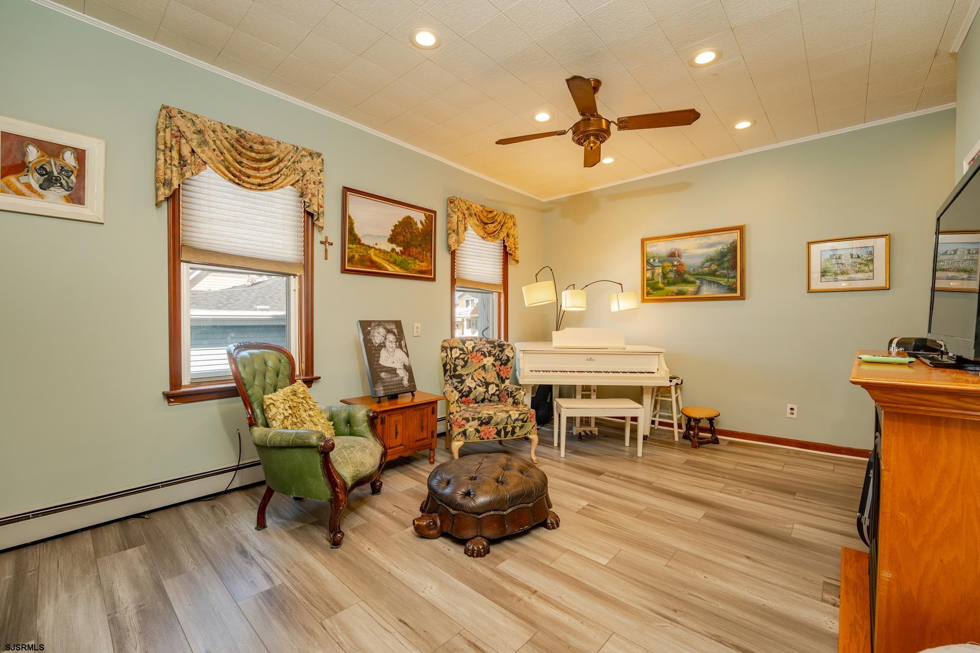 216 East Fern Road Wildwood Crest, NJ 08260 - Photo 34 of 93 a living room with furniture and a table