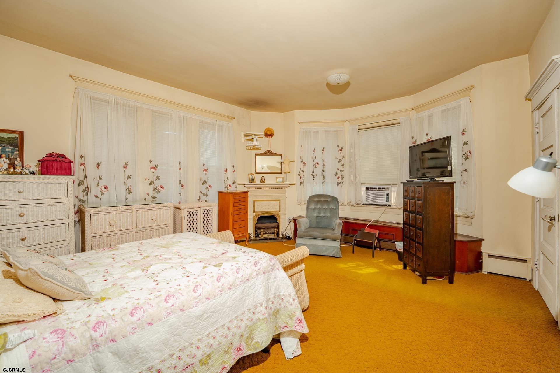 216 East Fern Road Wildwood Crest, NJ 08260 - Photo 41 of 93 a bedroom with a bed dresser and flat screen tv