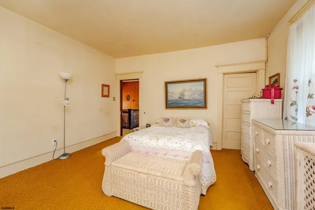 an aerial view of houses with a street