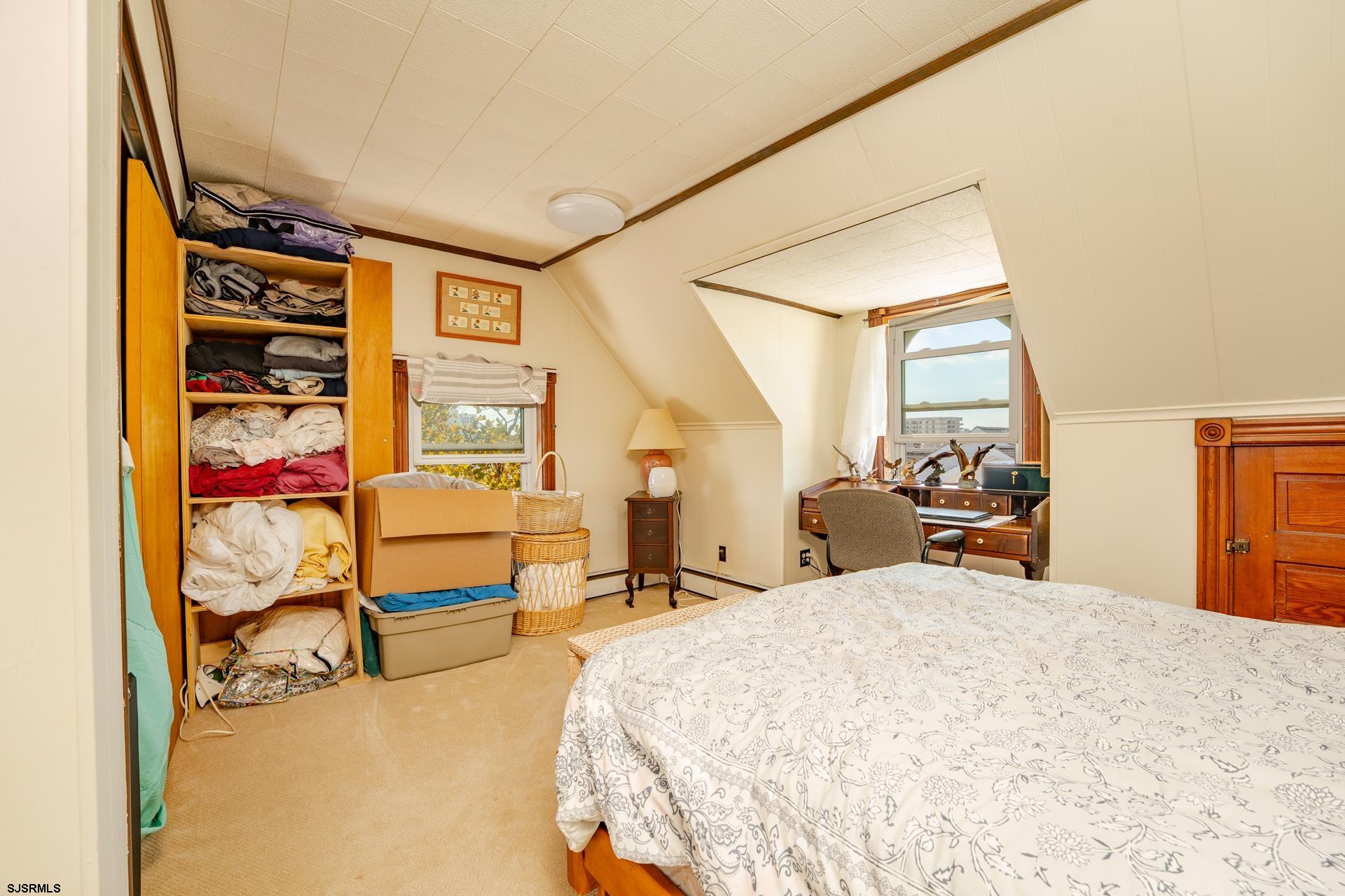 216 East Fern Road Wildwood Crest, NJ 08260 - Photo 54 of 93 a bed room with a bed and a chair