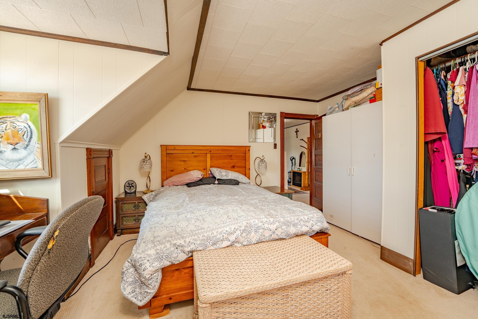 216 East Fern Road Wildwood Crest, NJ 08260 - Photo 55 of 93 a bedroom with a bed and a flat tv screen on the dresser