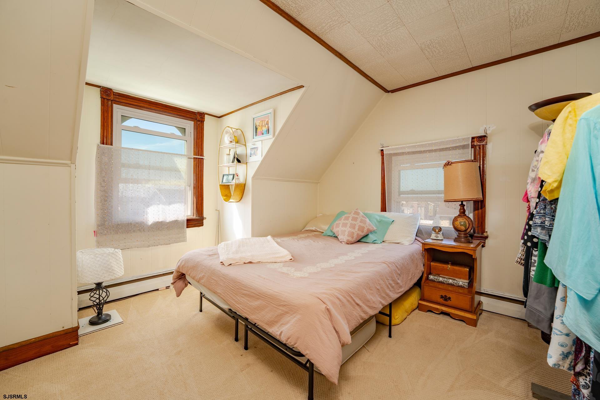 216 East Fern Road Wildwood Crest, NJ 08260 - Photo 58 of 93 a bedroom with a bed and a window