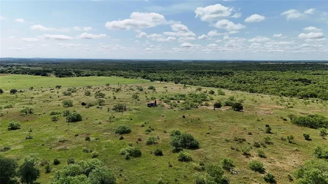 a view of a large body of water with a large building in the background