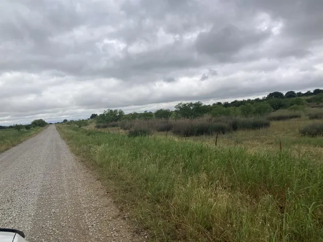 a view of a lake with a big yard