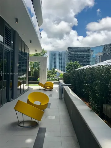 a dining room with a table and chairs