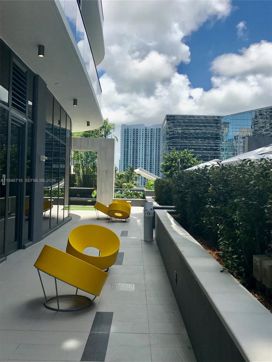 55 Southwest 9th Street, Unit 2807 Miami, FL 33130 - Photo 16 of 20 a swimming pool with outdoor seating yard and barbeque oven