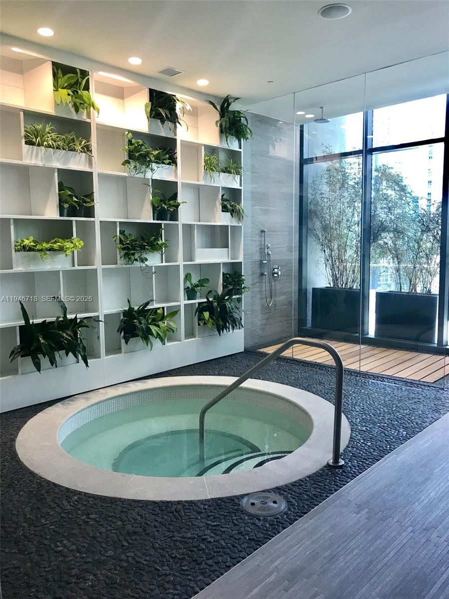 55 Southwest 9th Street, Unit 2807 Miami, FL 33130 - Photo 20 of 20 a dining room with a table and chairs