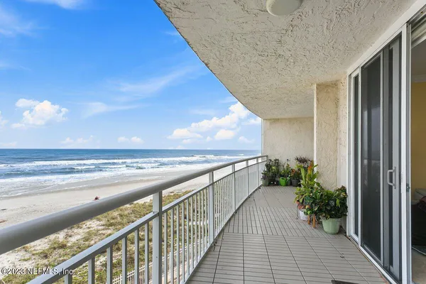 a view of balcony with furniture