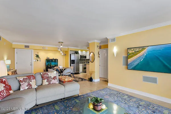 a living room with furniture and a rug