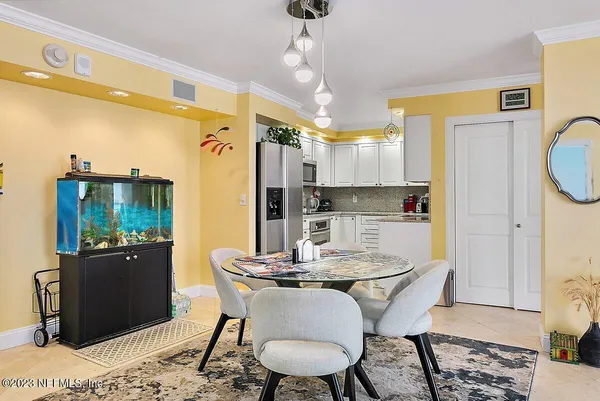 a dining room with furniture and window