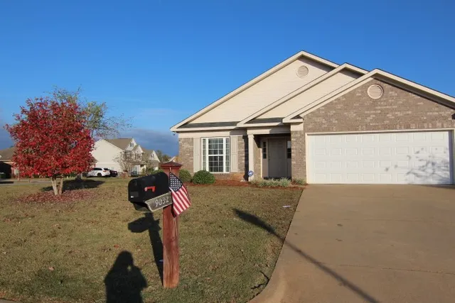 front view of a house with a yard