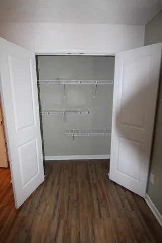 an empty room with wooden floor