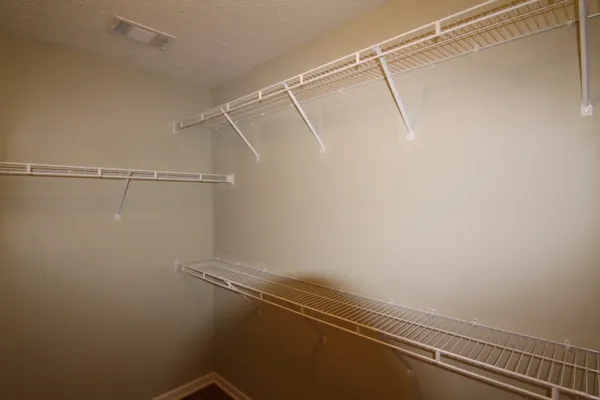 a view of a room with racks on the wall