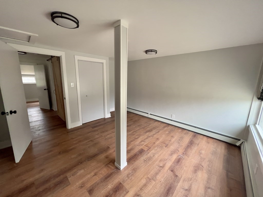 60 Corcoran Boulevard Springfield, MA 01118 - Photo 15 of 30 a view of empty room with wooden floor