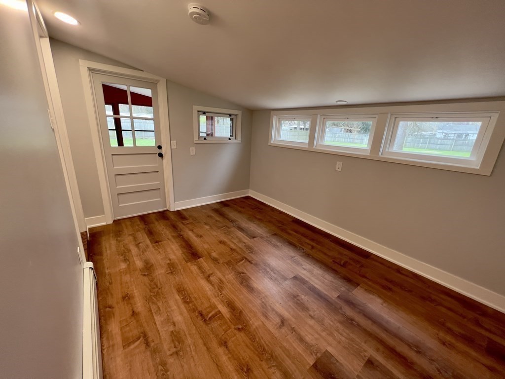 60 Corcoran Boulevard Springfield, MA 01118 - Photo 17 of 30 a view of empty room with wooden floor and fan