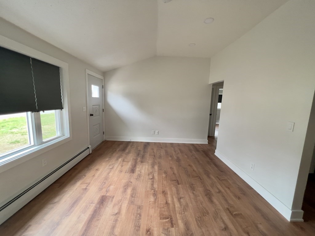 60 Corcoran Boulevard Springfield, MA 01118 - Photo 7 of 30 wooden floor in an empty room with a window