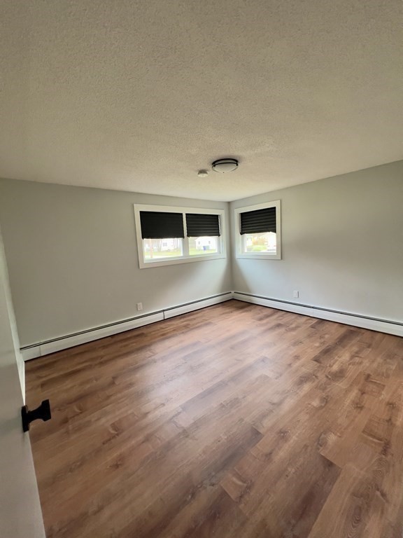 60 Corcoran Boulevard Springfield, MA 01118 - Photo 10 of 30 wooden floor in an empty room