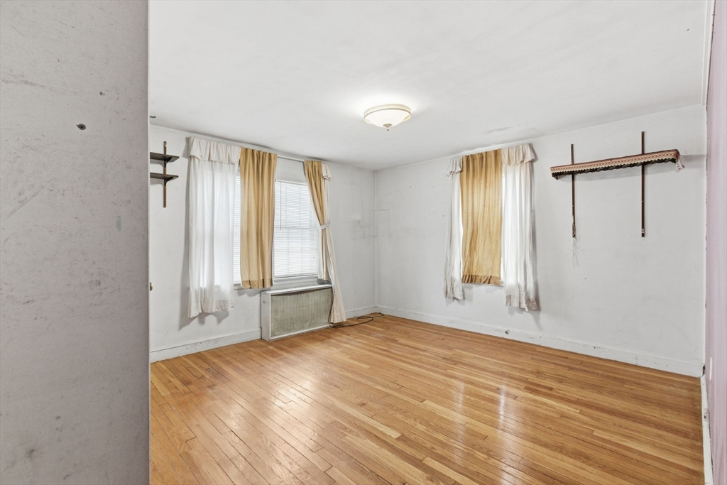 71 Liberty Street Acton, MA 01720 - Photo 6 of 13 a view of an empty room with a window