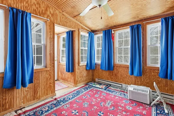 a living room with a couch and a window