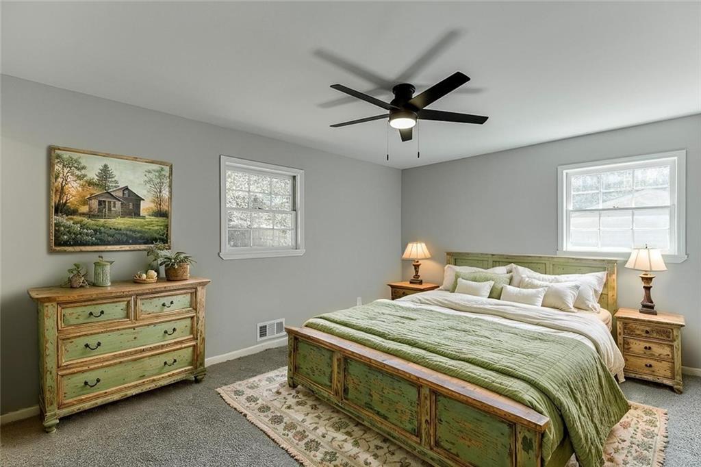 5837 Meadow View Lane Flowery Branch, GA 30542 - Photo 20 of 47 a bedroom with a bed and a window