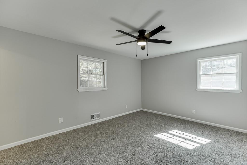5837 Meadow View Lane Flowery Branch, GA 30542 - Photo 21 of 47 a view of an empty room and window