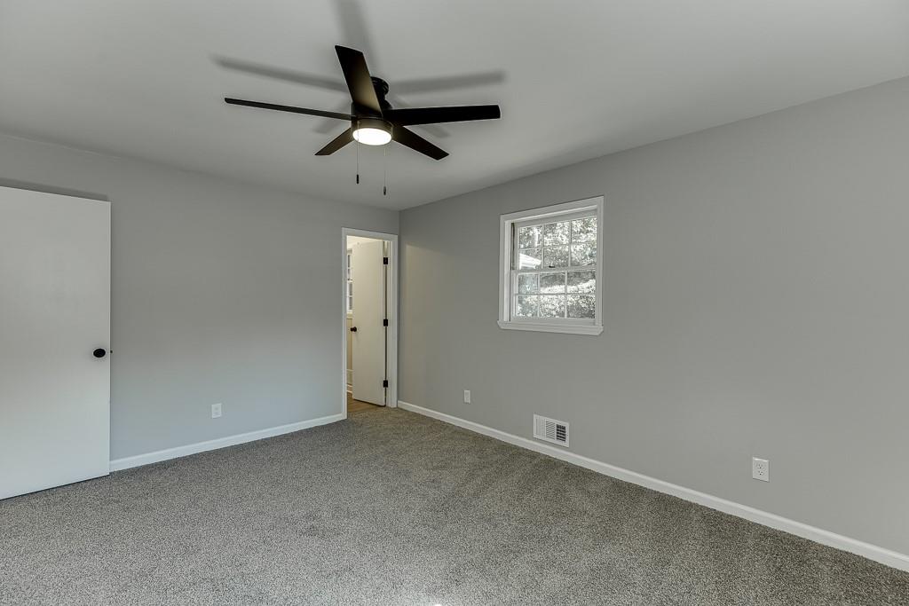 5837 Meadow View Lane Flowery Branch, GA 30542 - Photo 22 of 47 a view of an empty room