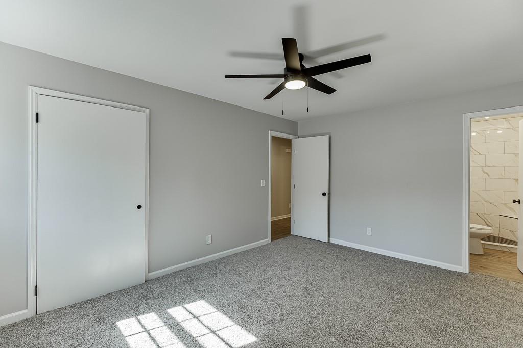 5837 Meadow View Lane Flowery Branch, GA 30542 - Photo 23 of 47 a view of a livingroom with a ceiling fan and entryway