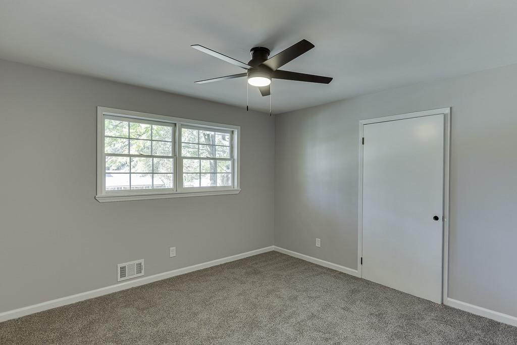 5837 Meadow View Lane Flowery Branch, GA 30542 - Photo 25 of 47 a view of an empty room with a window