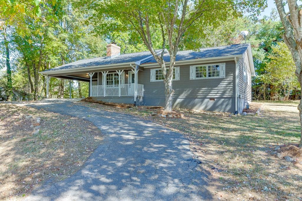 5837 Meadow View Lane Flowery Branch, GA 30542 - Photo 3 of 47 a front view of a house with a yard