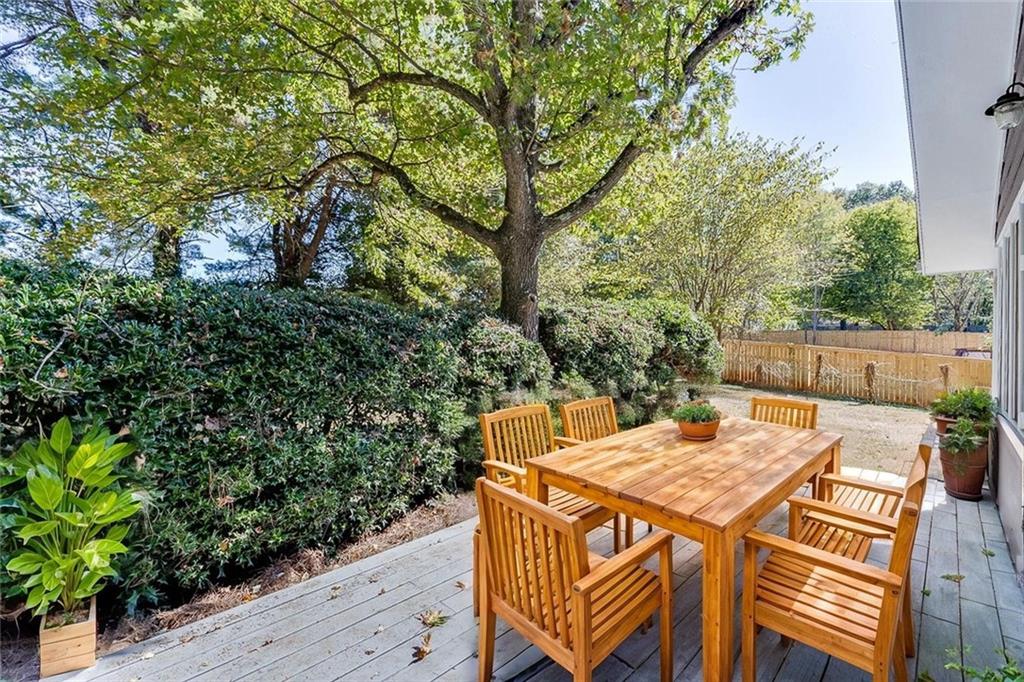 5837 Meadow View Lane Flowery Branch, GA 30542 - Photo 36 of 47 a view of a dinning table and chairs on the deck