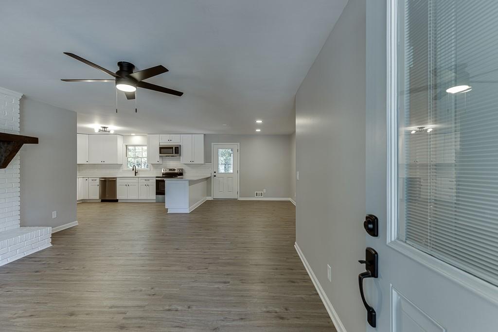 5837 Meadow View Lane Flowery Branch, GA 30542 - Photo 4 of 47 a view of kitchen with furniture and a ceiling fan