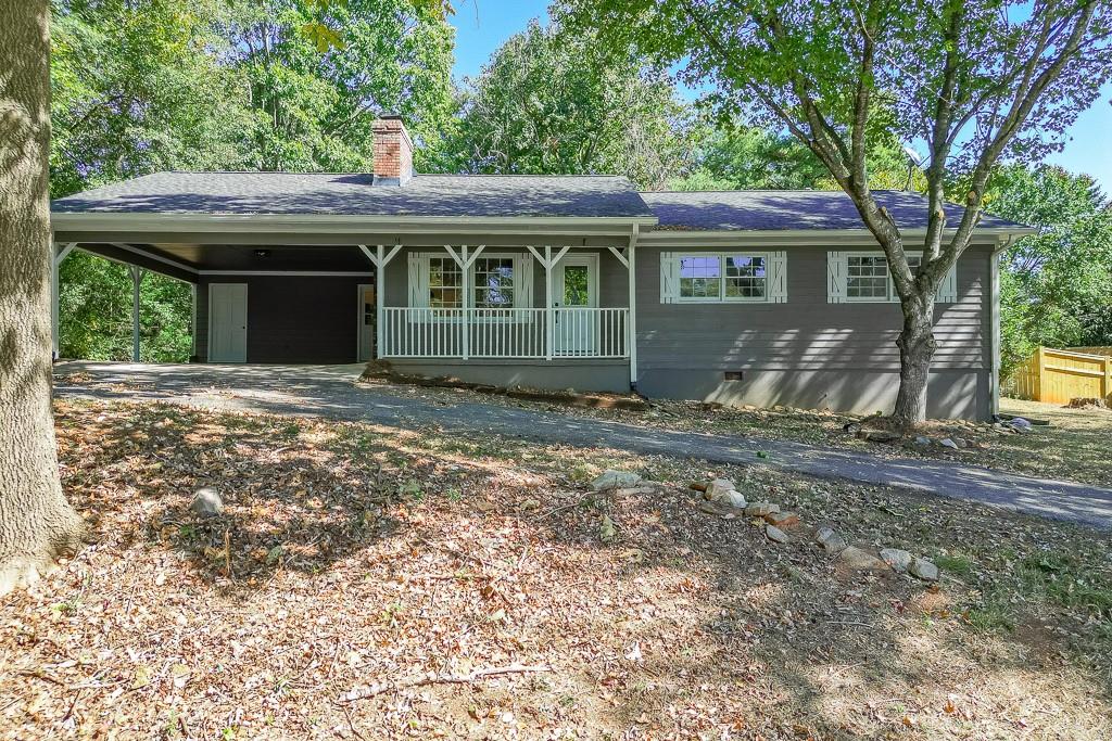 5837 Meadow View Lane Flowery Branch, GA 30542 - Photo 41 of 47 a front view of a house with a garden