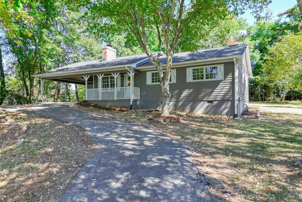 5837 Meadow View Lane Flowery Branch, GA 30542 - Photo 42 of 47 a front view of a house with a garden