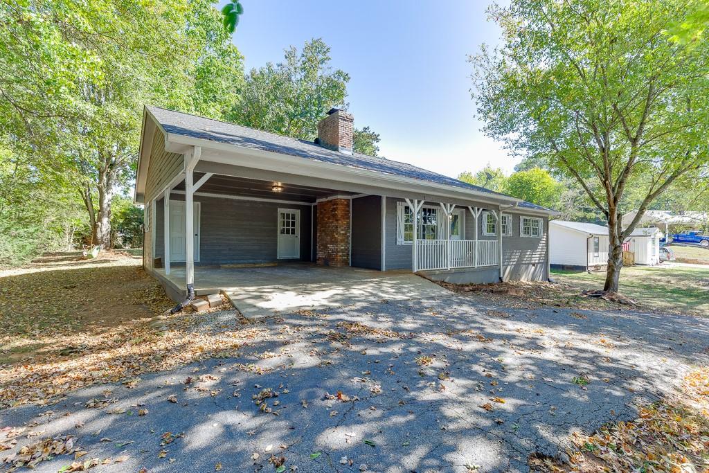 5837 Meadow View Lane Flowery Branch, GA 30542 - Photo 47 of 47 a view of a house with a yard