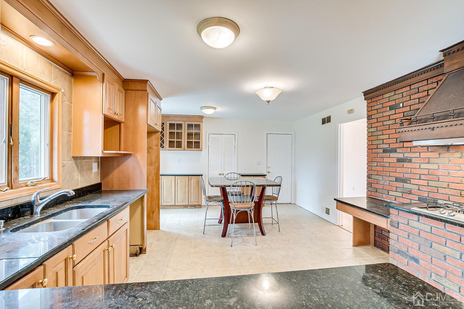 5 Robin Road Edison, NJ 08820 - Photo 12 of 43 a living room with stainless steel appliances granite countertop furniture and a kitchen view